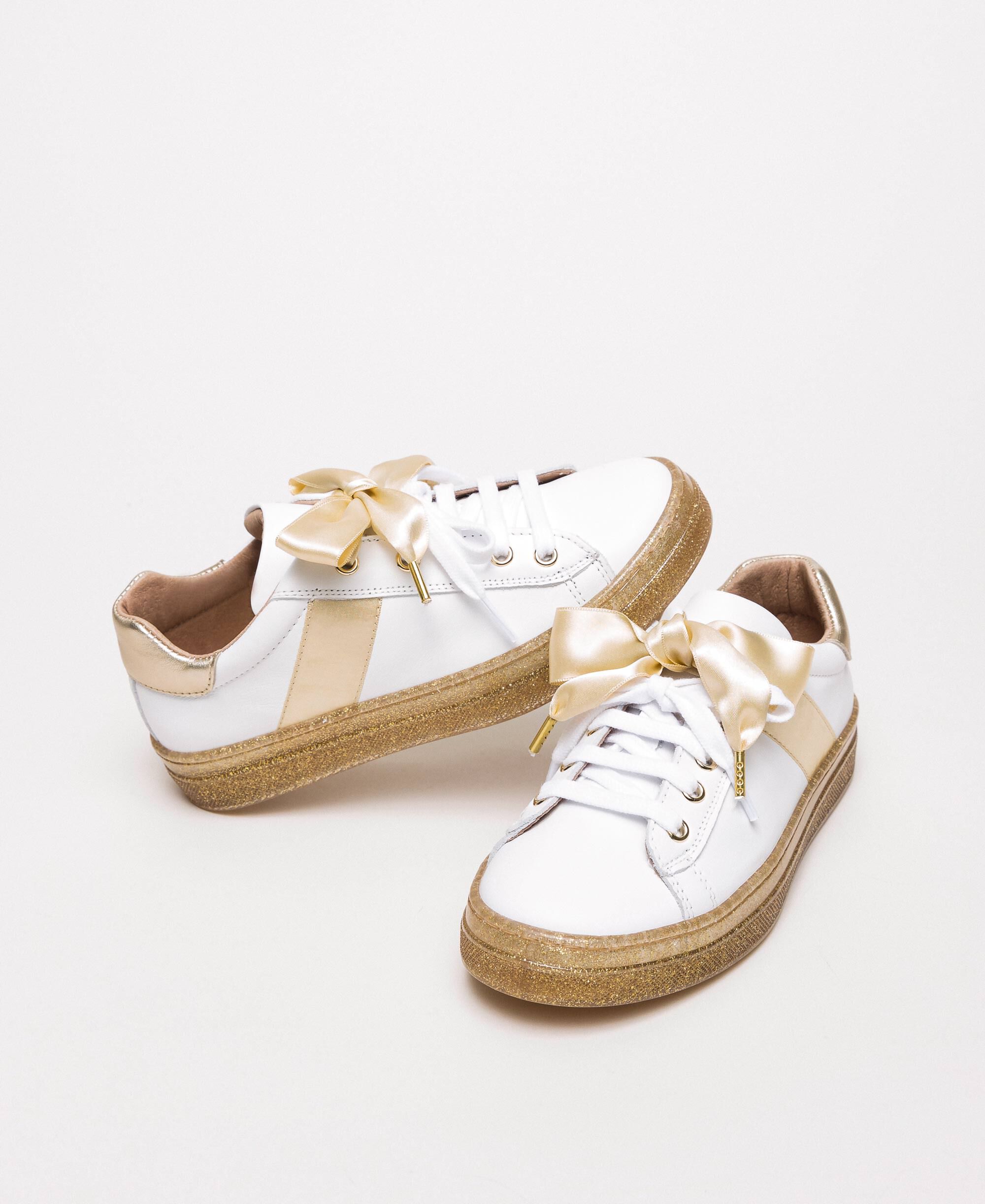 white bow trainers
