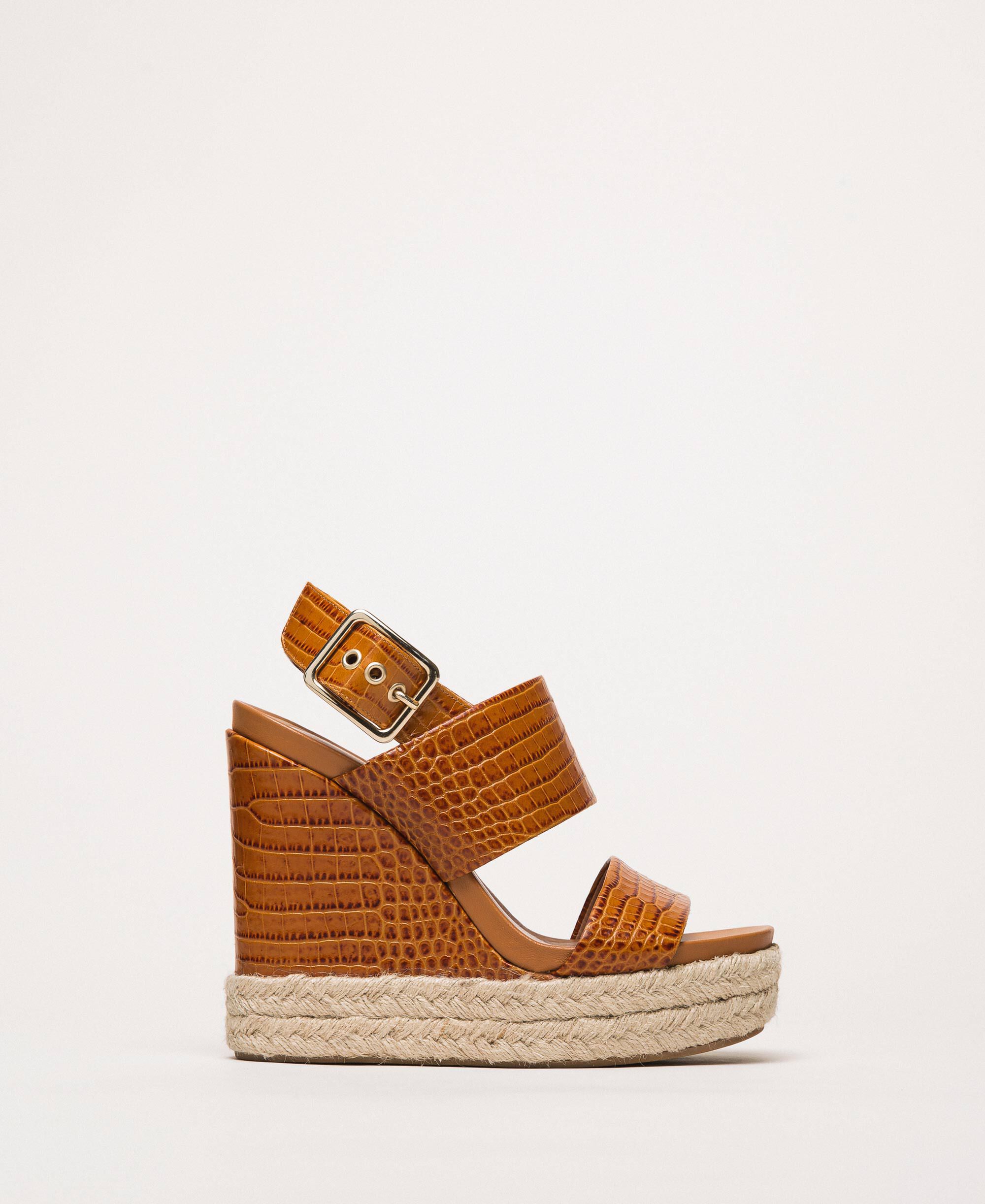 Leather sandals with croc print and wedge
