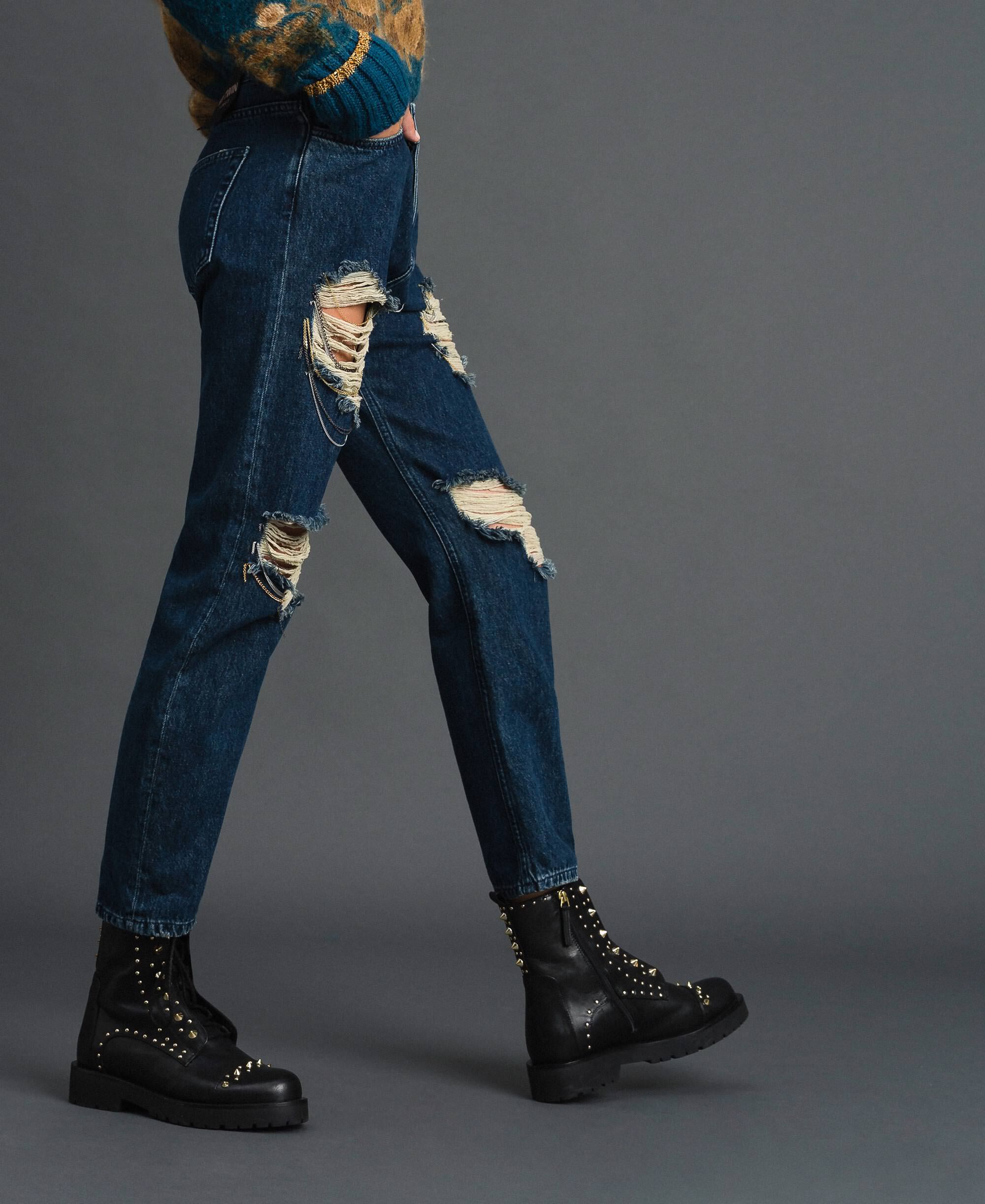 jeans with holes and chains