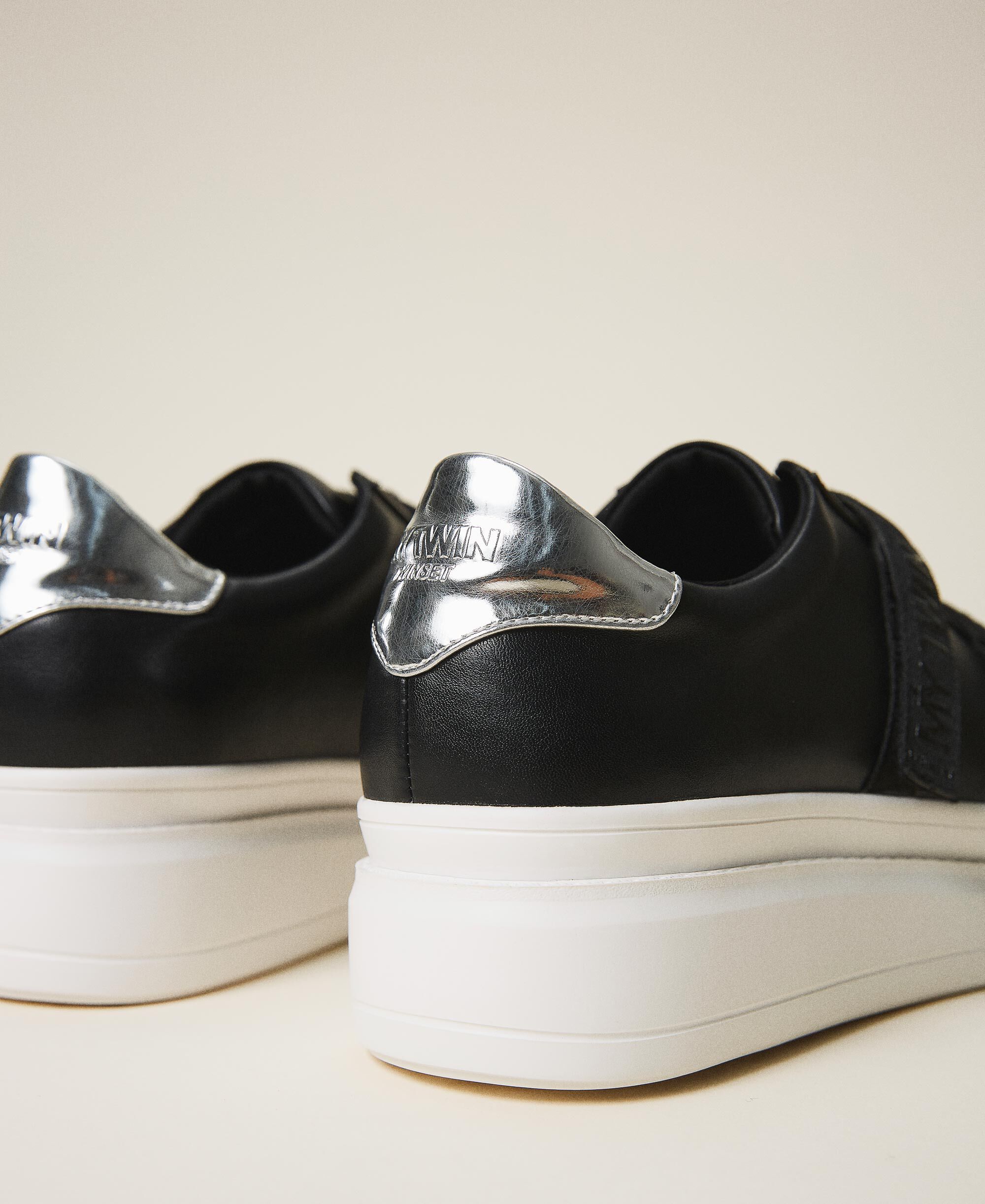 black faux leather trainers