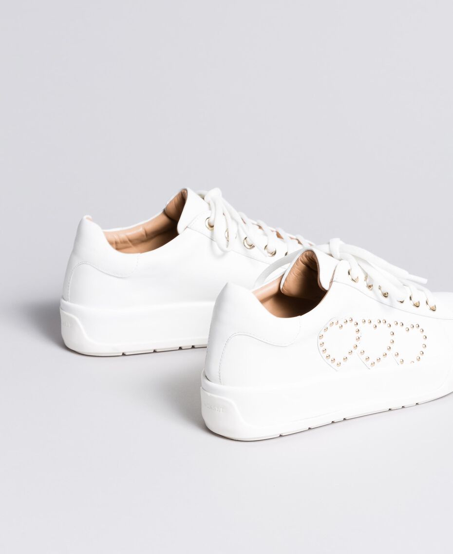 white sneakers with heart on side