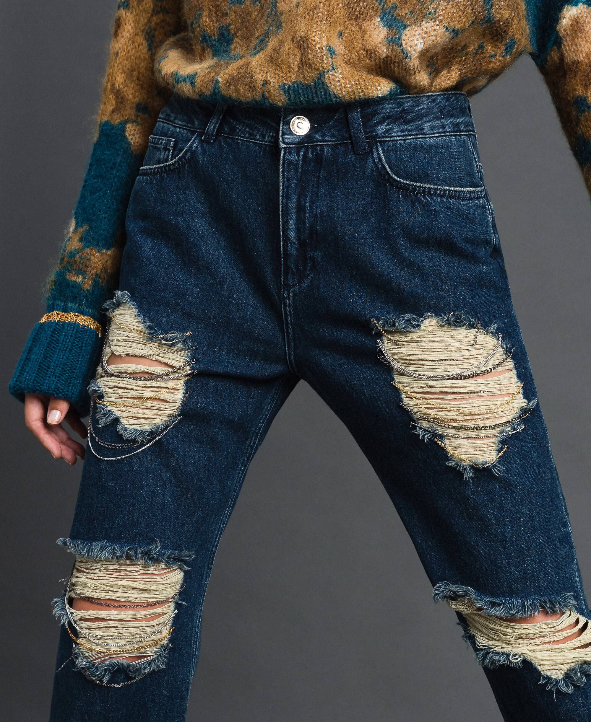 jeans with rips and chains