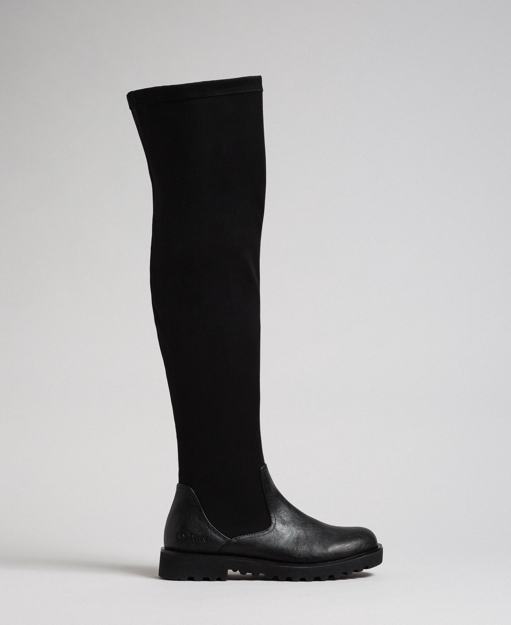 Thigh high boots in stretch fabric 