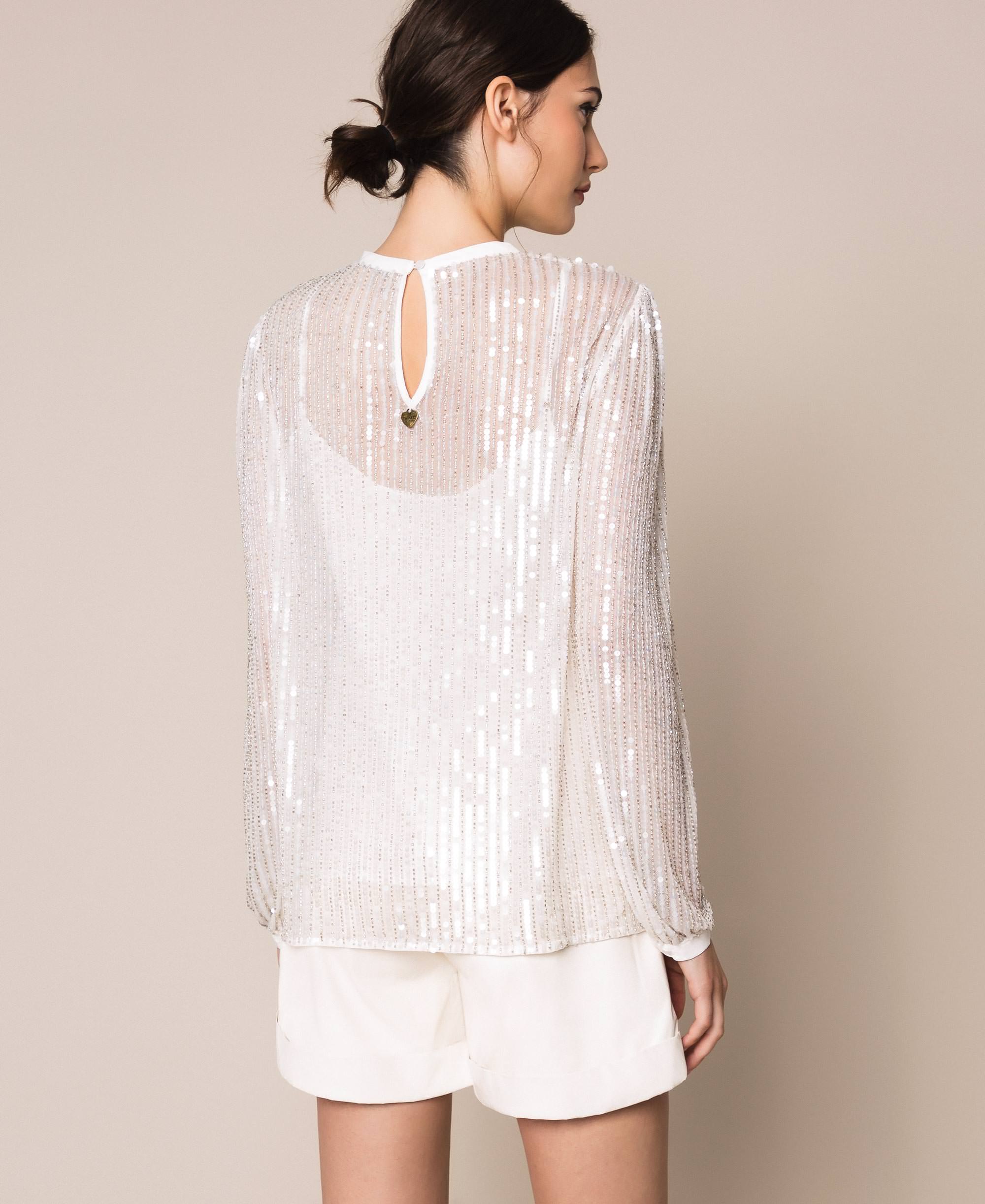 white sequin blouse