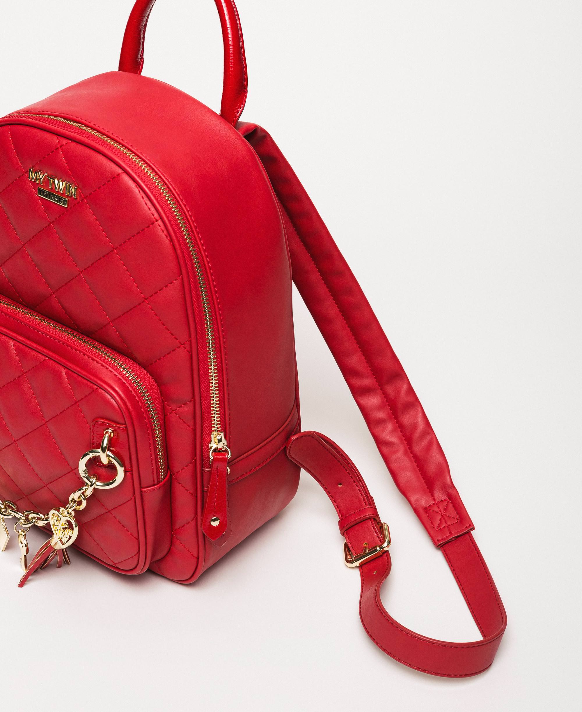 red faux leather backpack