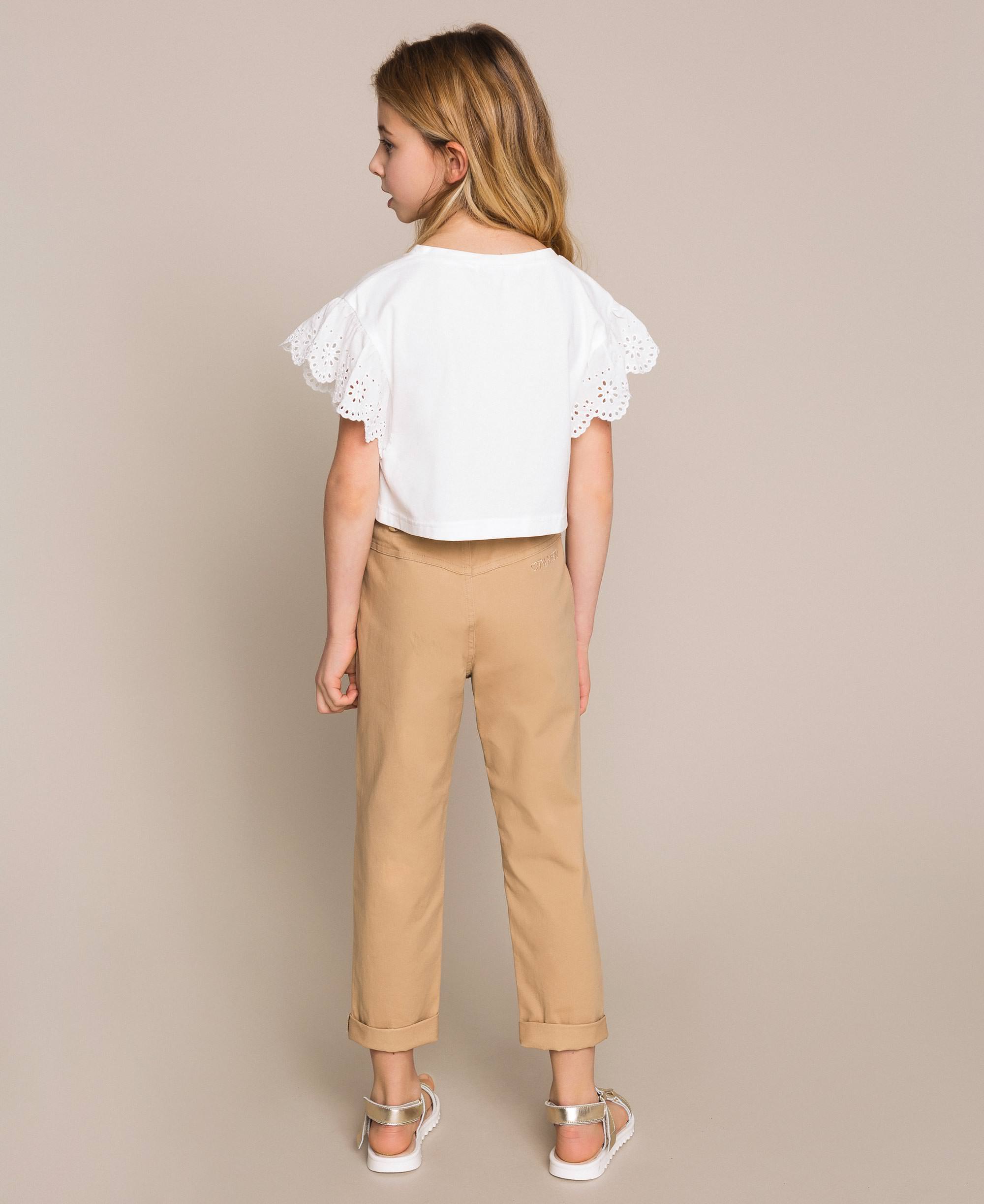 beige trousers matching shirt