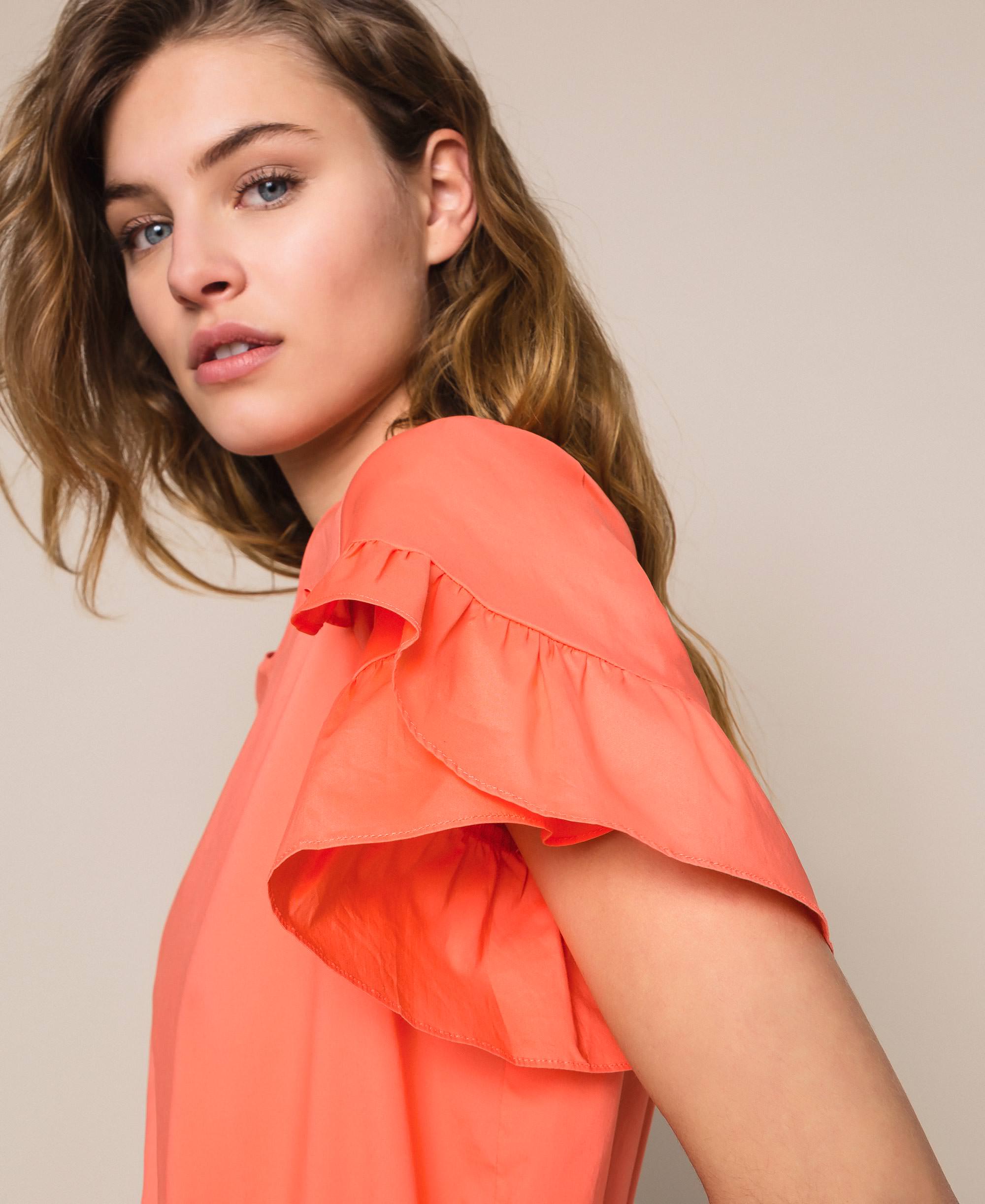 orange ruffle blouse