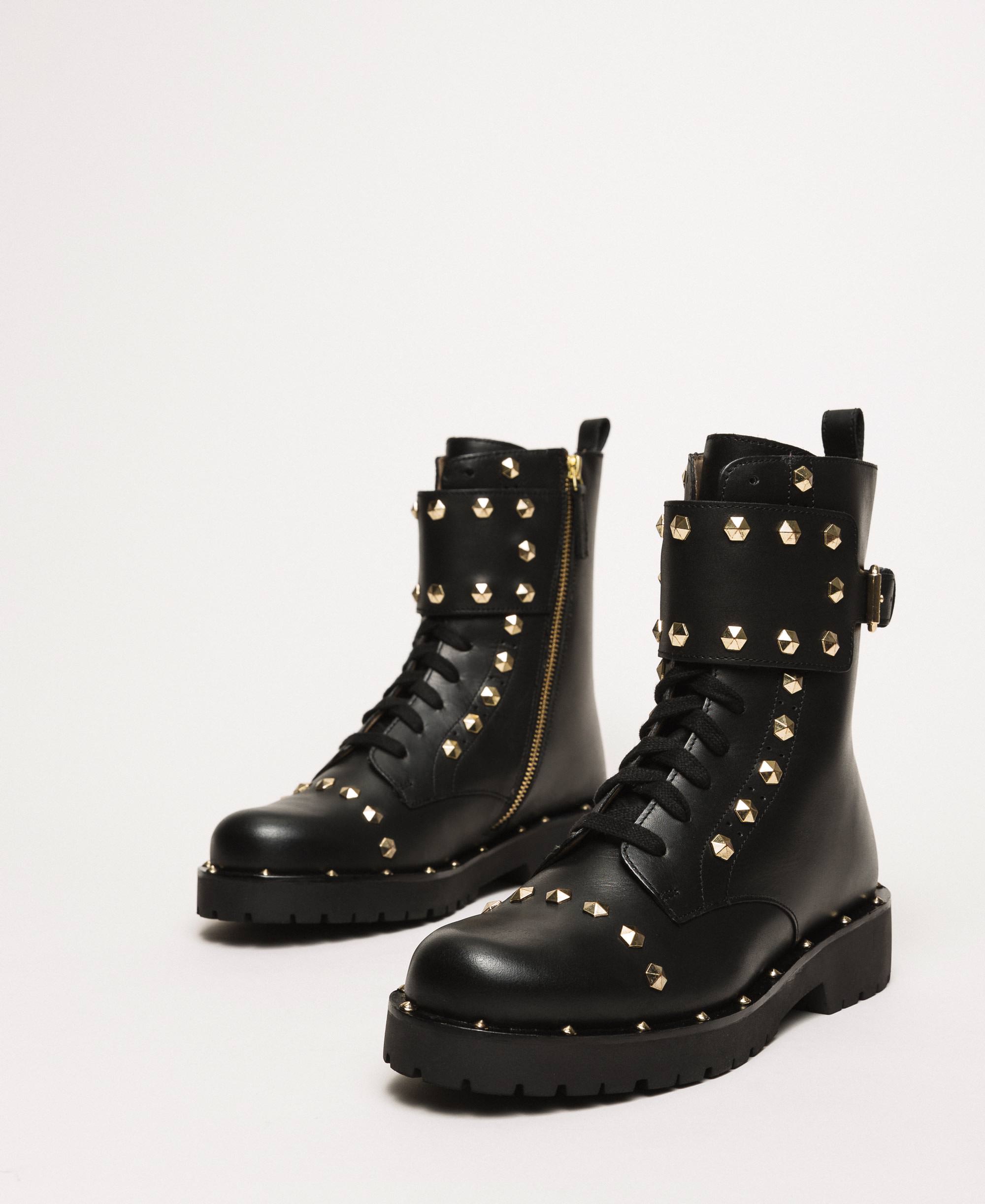 black boots with studs around sole