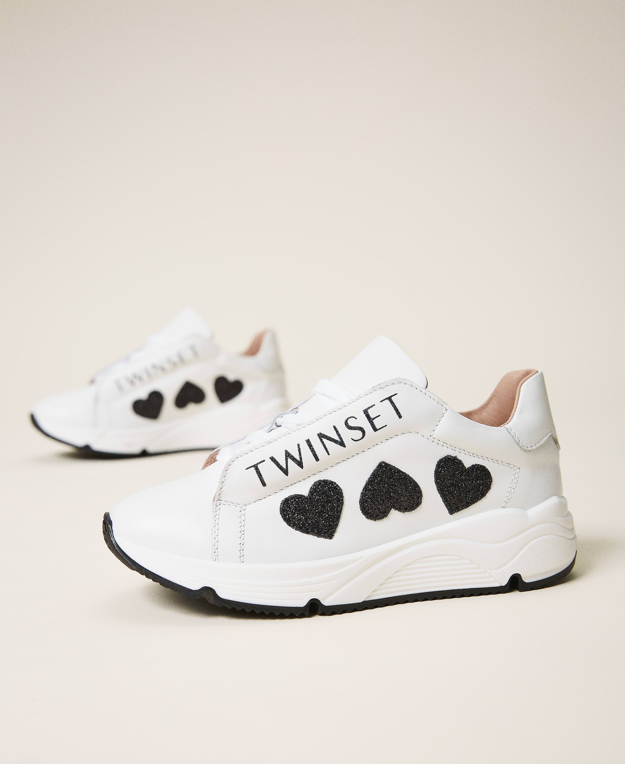 Leather running shoes with logo and hearts